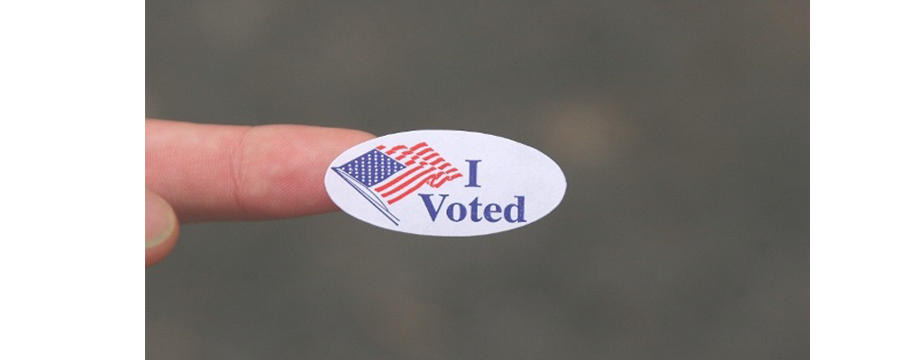 I voted sticker on finger